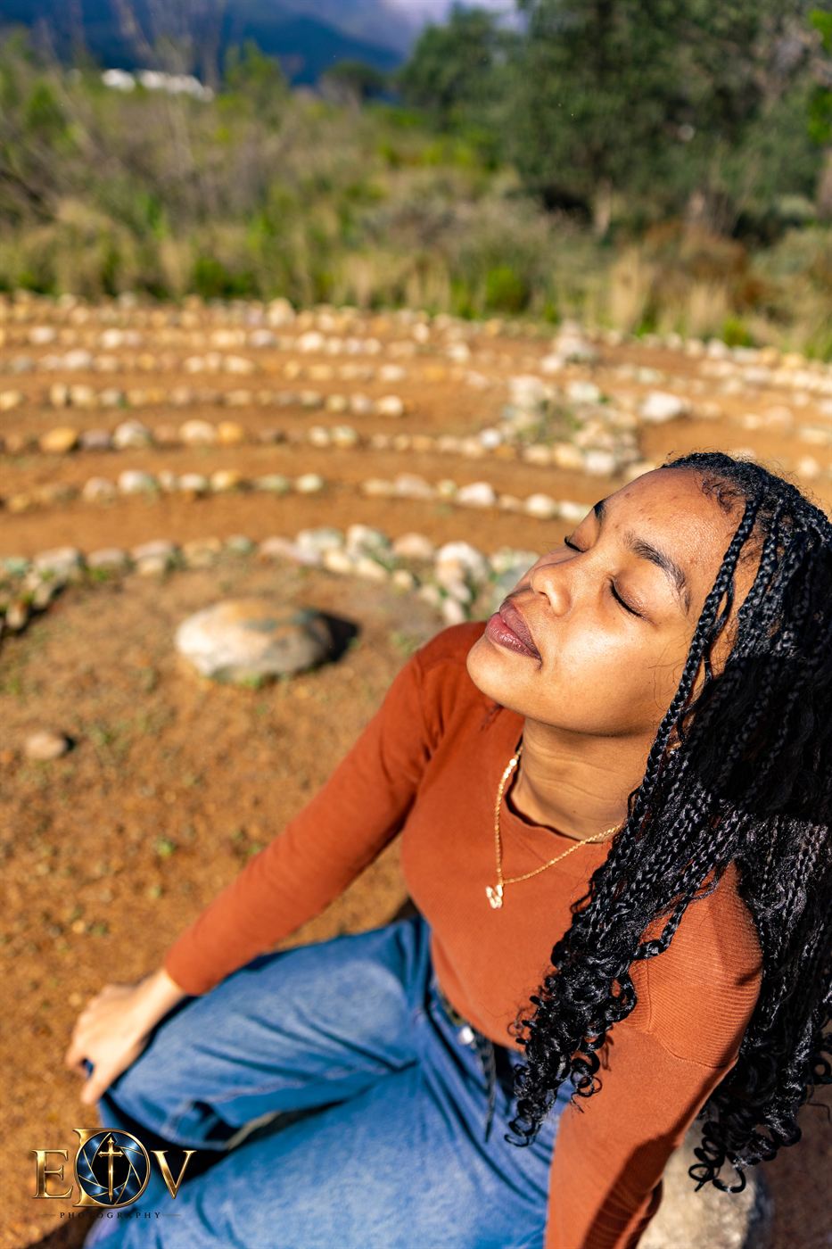 Young woman resting in the sun with her eyes closed, photographed from above